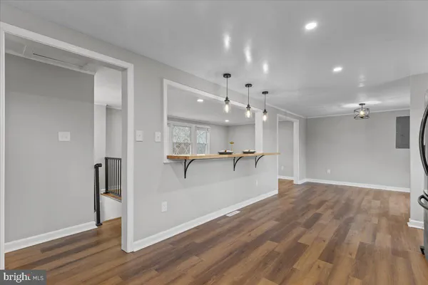 a view of a room with wooden floor