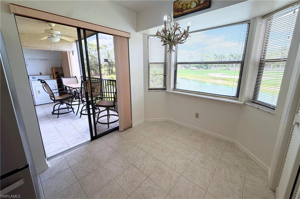 7360 St Ives Way, Unit 2205 Naples, FL 34104 - Photo 14 of 37 a view of a livingroom with furniture and a window