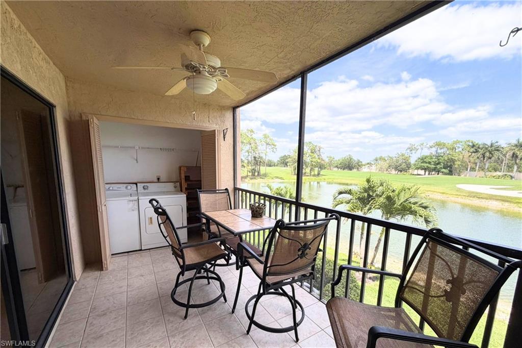 7360 St Ives Way, Unit 2205 Naples, FL 34104 - Photo 15 of 37 a view of a city from a balcony with furniture