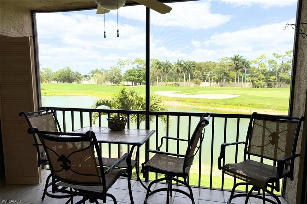 7360 St Ives Way, Unit 2205 Naples, FL 34104 - Photo 16 of 37 a view of a chairs and table in the balcony