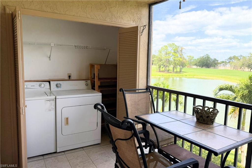 7360 St Ives Way, Unit 2205 Naples, FL 34104 - Photo 17 of 37 a view of a dining room with furniture window and wooden floor