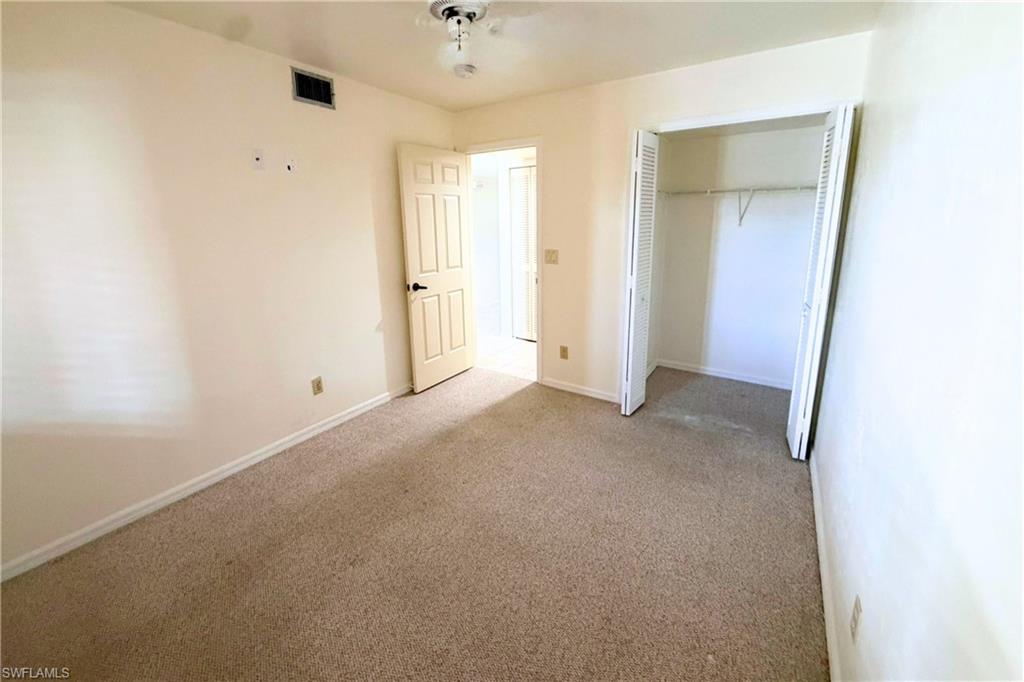 7360 St Ives Way, Unit 2205 Naples, FL 34104 - Photo 30 of 37 an empty room with a bathroom