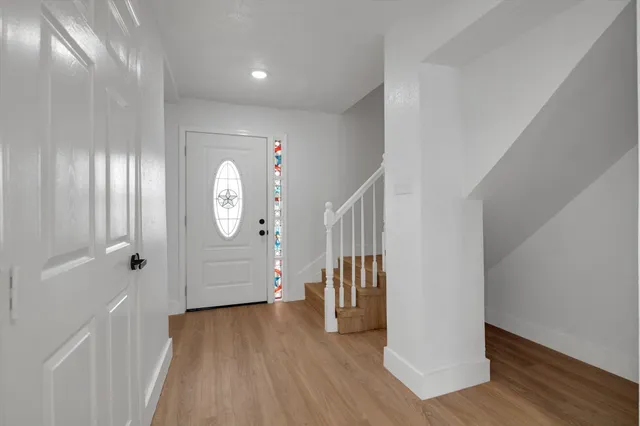 a view of entryway with wooden floor