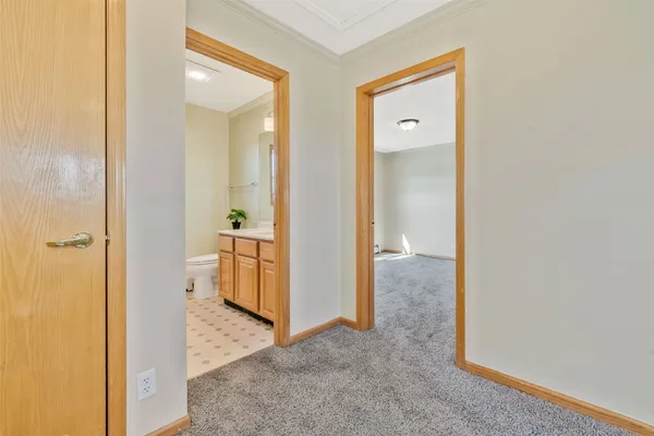 a view of a hallway with closet area