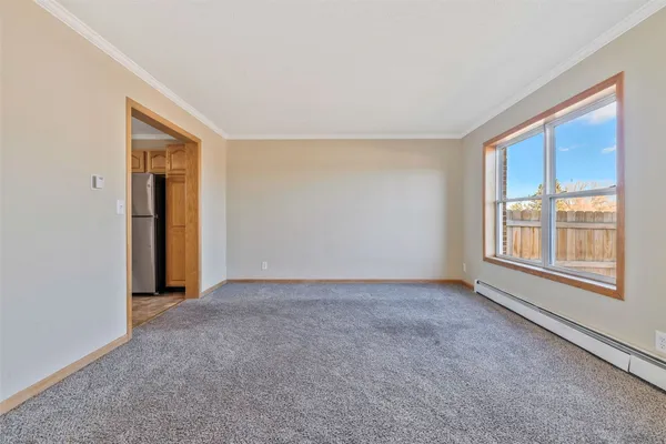 a view of an empty room with a window