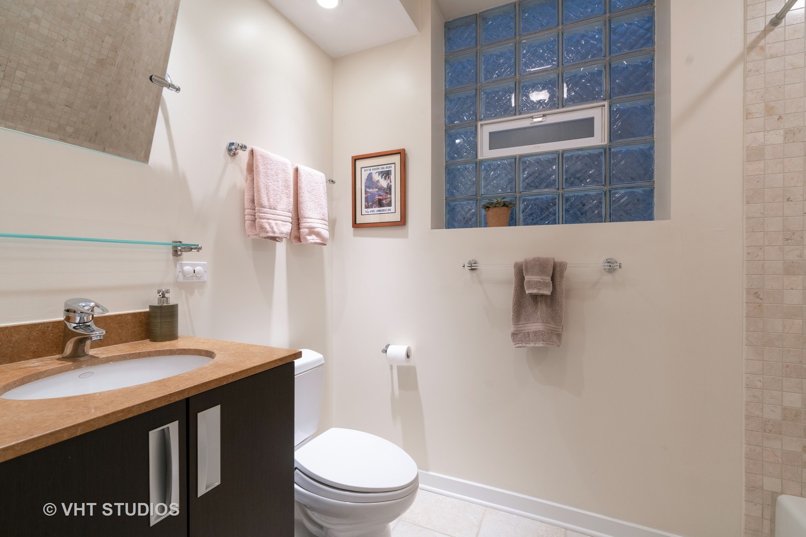 Undisclosed Address Chicago, IL 60622 - Photo 18 of 25 a bathroom with a sink a toilet and a mirror