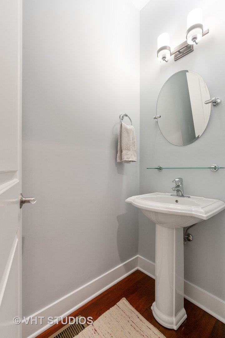 Undisclosed Address Chicago, IL 60622 - Photo 19 of 25 a bathroom with a sink and a mirror