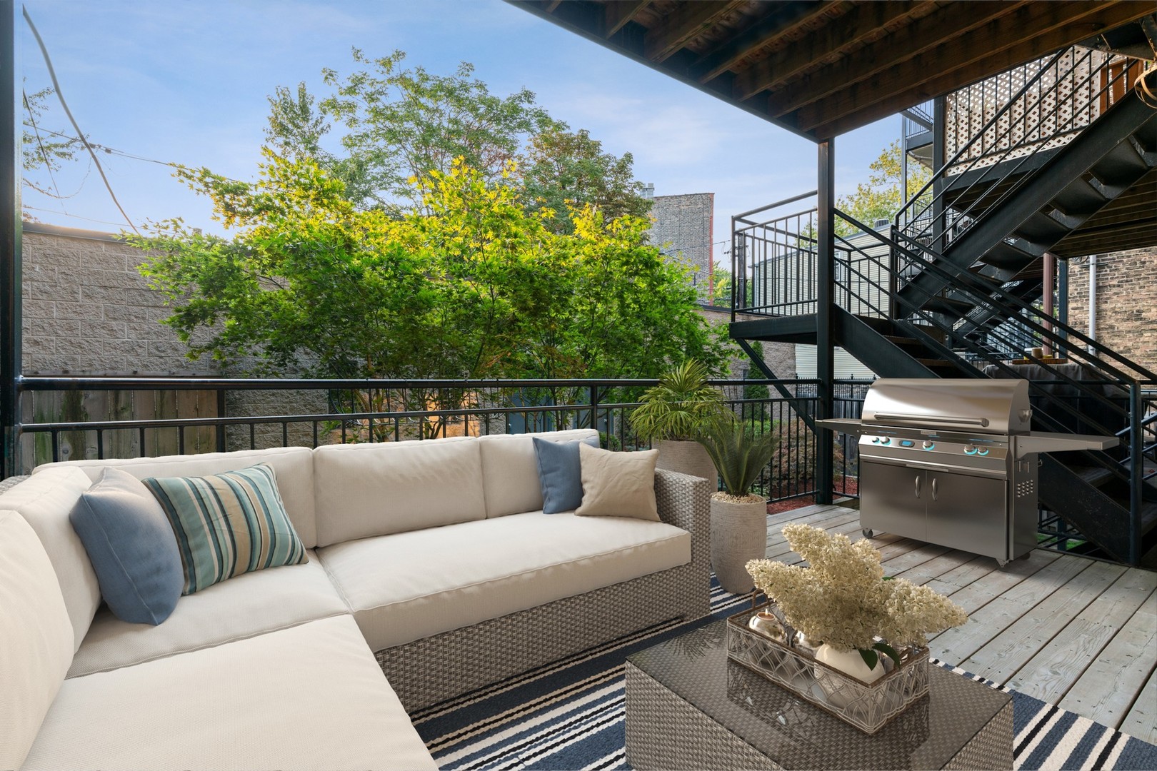 Undisclosed Address Chicago, IL 60622 - Photo 20 of 25 a roof deck with couches and wooden floor