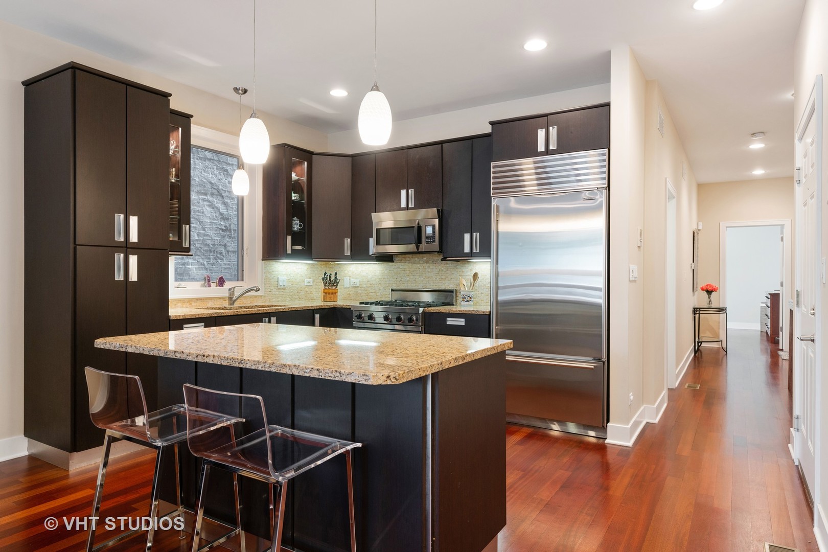 Undisclosed Address Chicago, IL 60622 - Photo 7 of 25 a kitchen with stainless steel appliances granite countertop a sink refrigerator and cabinets
