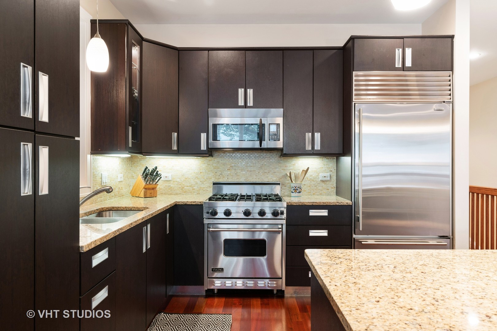 Undisclosed Address Chicago, IL 60622 - Photo 9 of 25 a kitchen with a stove and a microwave