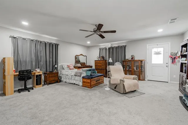 a bed room with furniture and a window