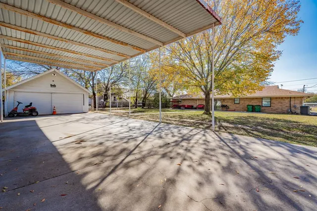 a view of car parked in front of house