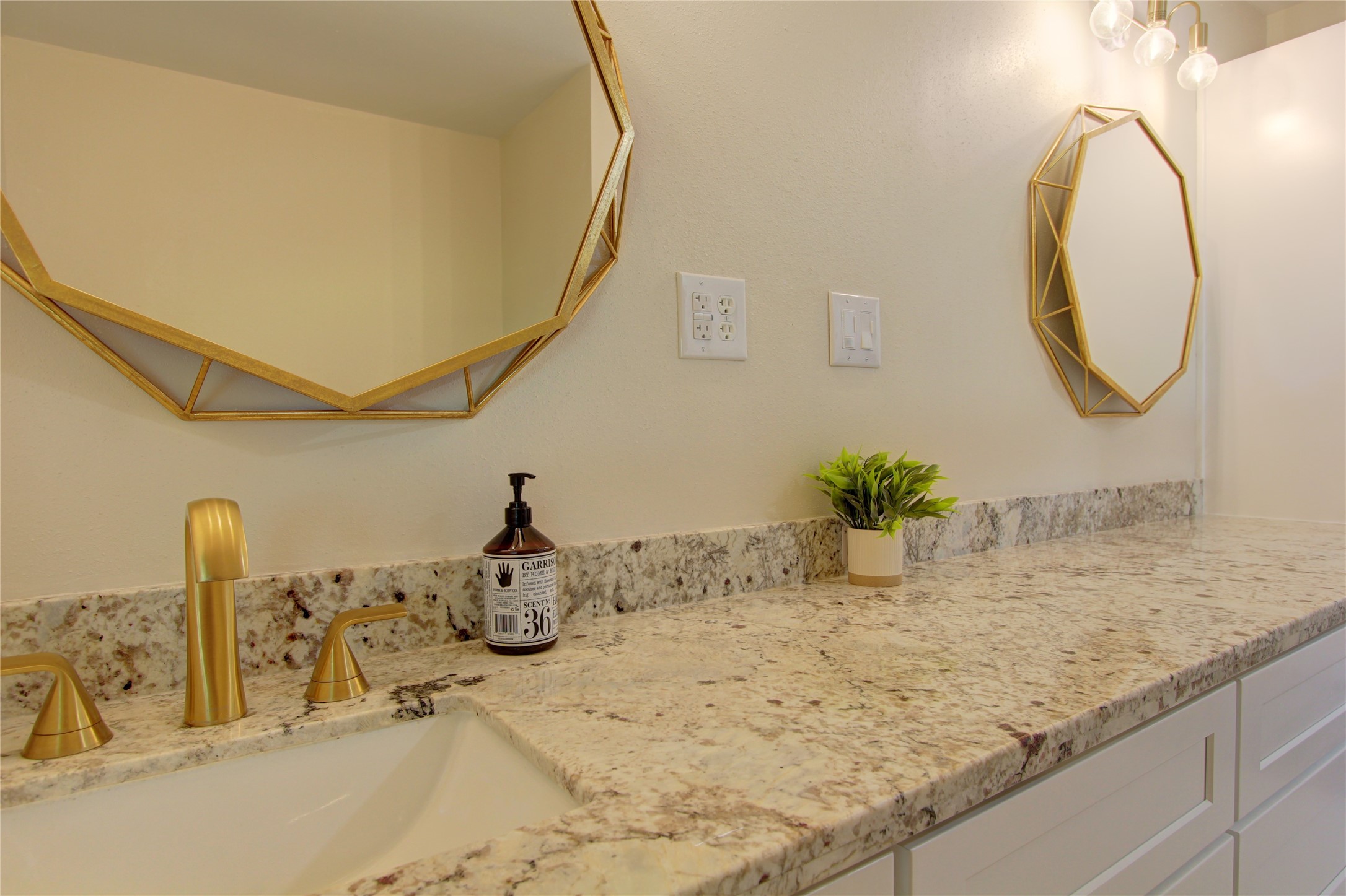 1904 Pine Street Liberty, TX 77575 - Photo 14 of 33 a bathroom with a granite countertop sink a mirror and a shower