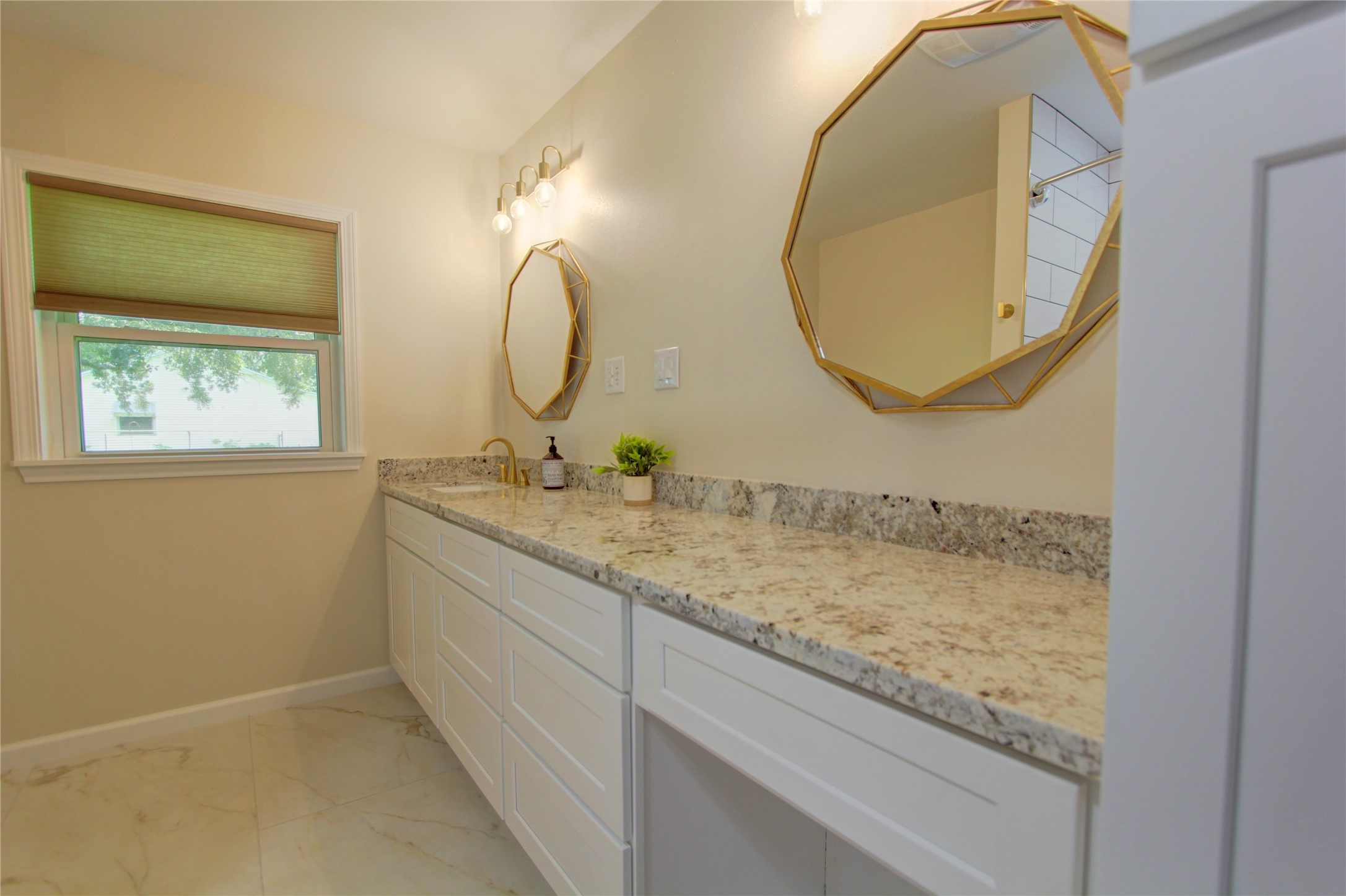 1904 Pine Street Liberty, TX 77575 - Photo 15 of 33 a bathroom with a granite countertop sink and a mirror
