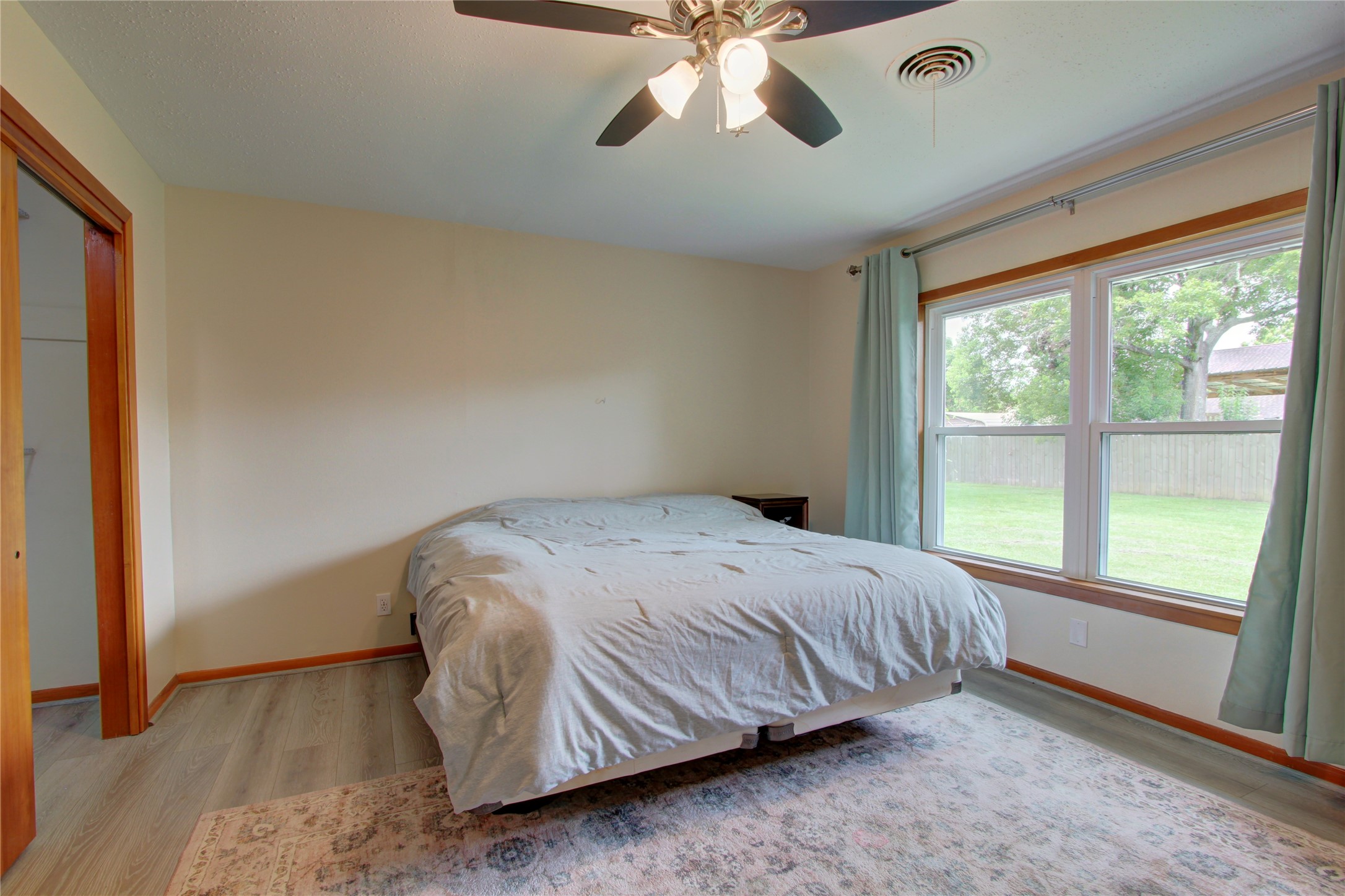 1904 Pine Street Liberty, TX 77575 - Photo 18 of 33 a bedroom with a bed and a large window