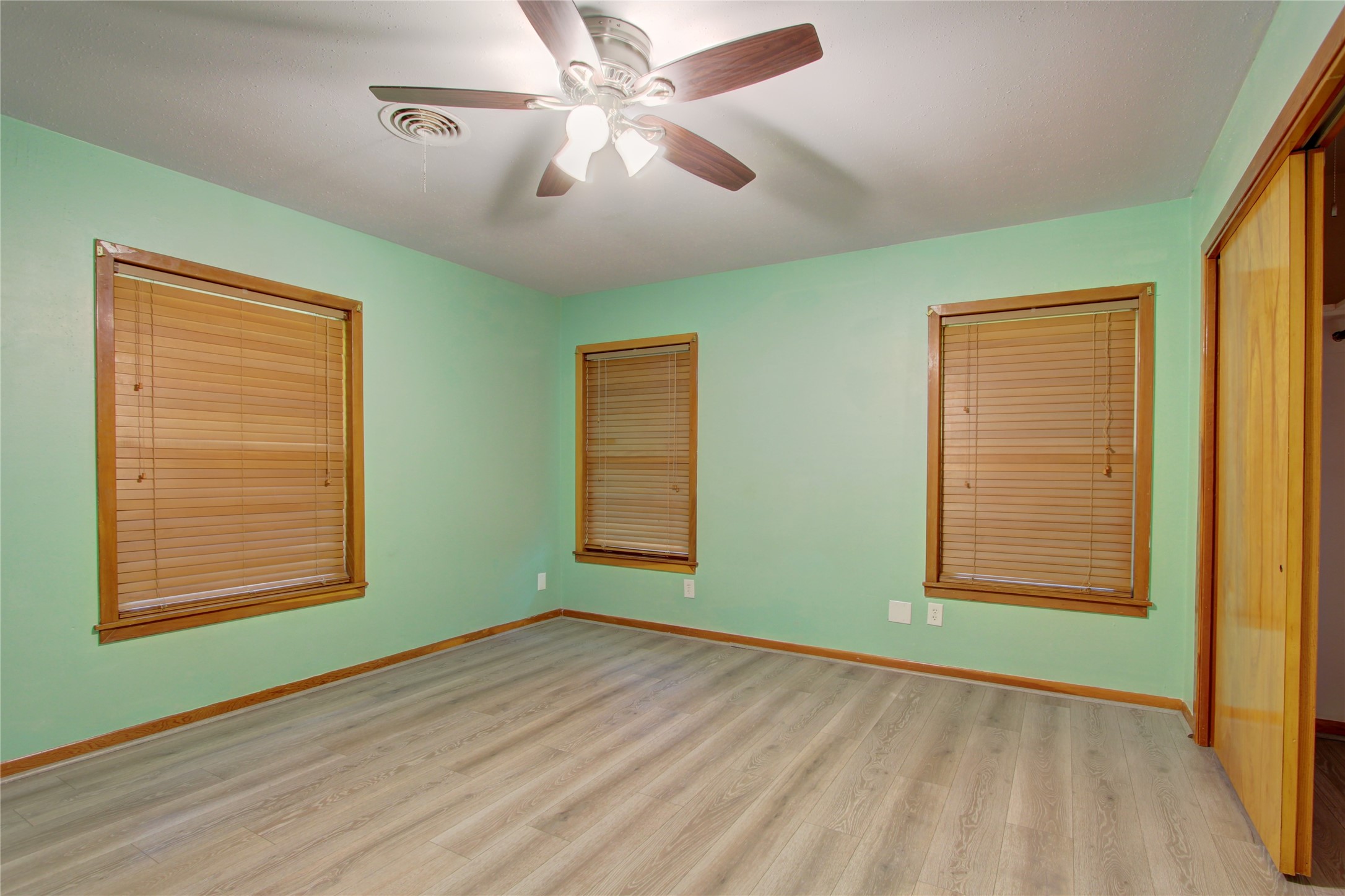 1904 Pine Street Liberty, TX 77575 - Photo 20 of 33 a view of an empty room with window and chandelier fan