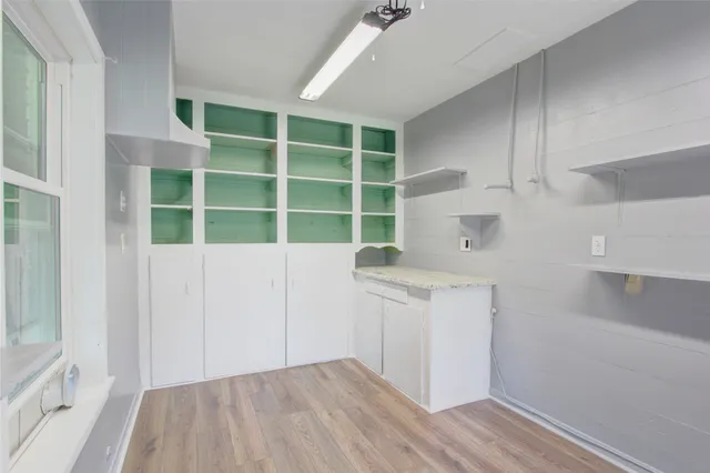 a kitchen with a sink and cabinets