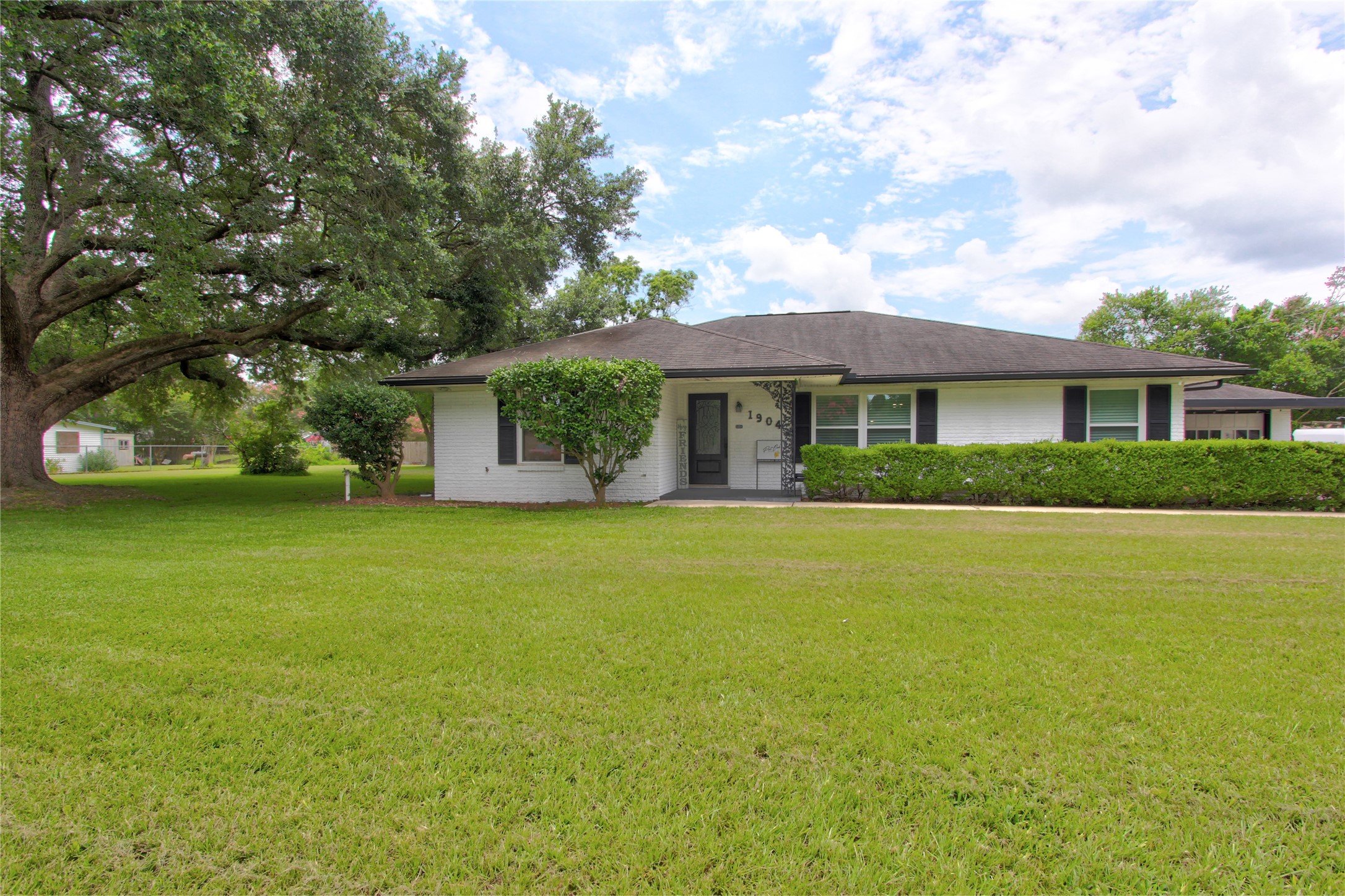 1904 Pine Street Liberty, TX 77575 - Photo 30 of 33 a front view of a house with a garden