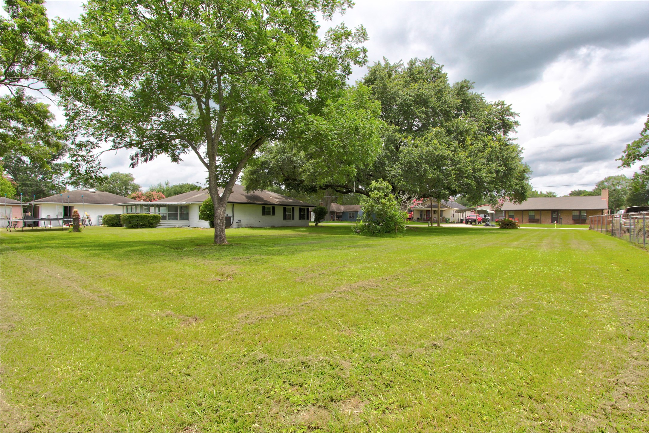 1904 Pine Street Liberty, TX 77575 - Photo 32 of 33 a view of a house with a big yard and large trees