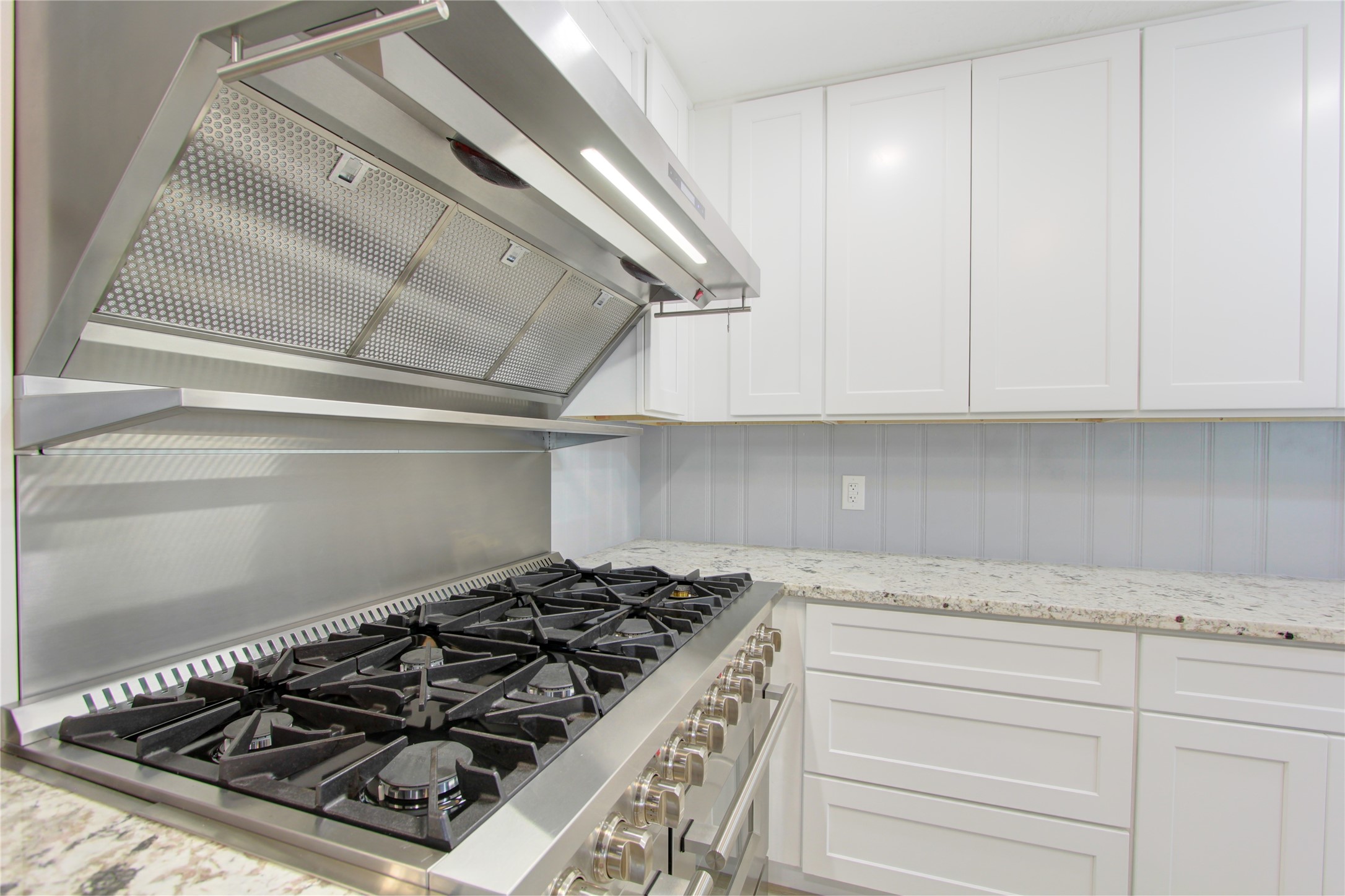 1904 Pine Street Liberty, TX 77575 - Photo 4 of 33 a stove top oven sitting inside of a kitchen