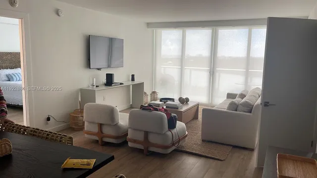 a living room with furniture and a window