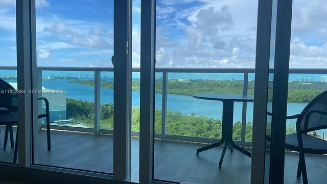 a view of a glass door and a porch