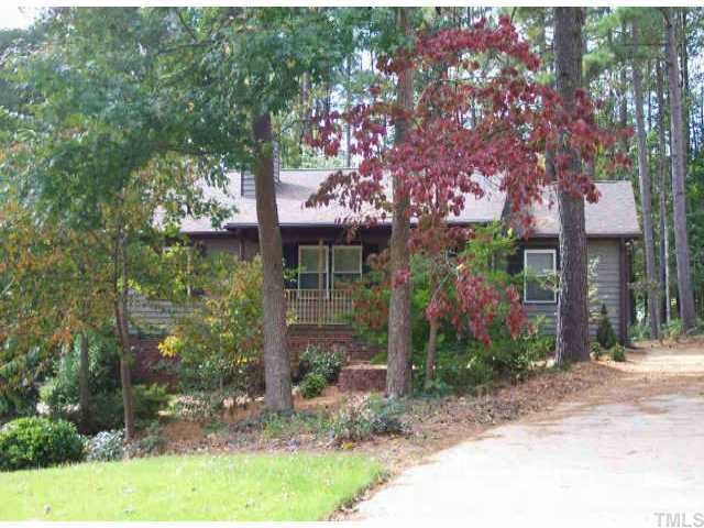 6917 Chamonix Place Raleigh, NC 27613 - Photo 1 of 1 a front view of a house with garden