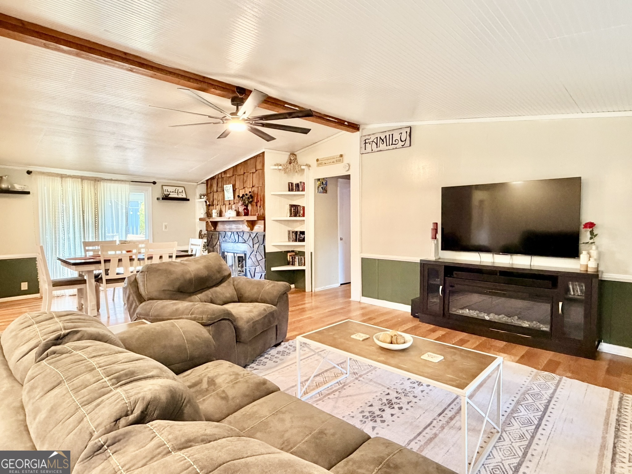 94 Country Place Temple, GA 30179 - Photo 16 of 36 a living room with furniture and a flat screen tv