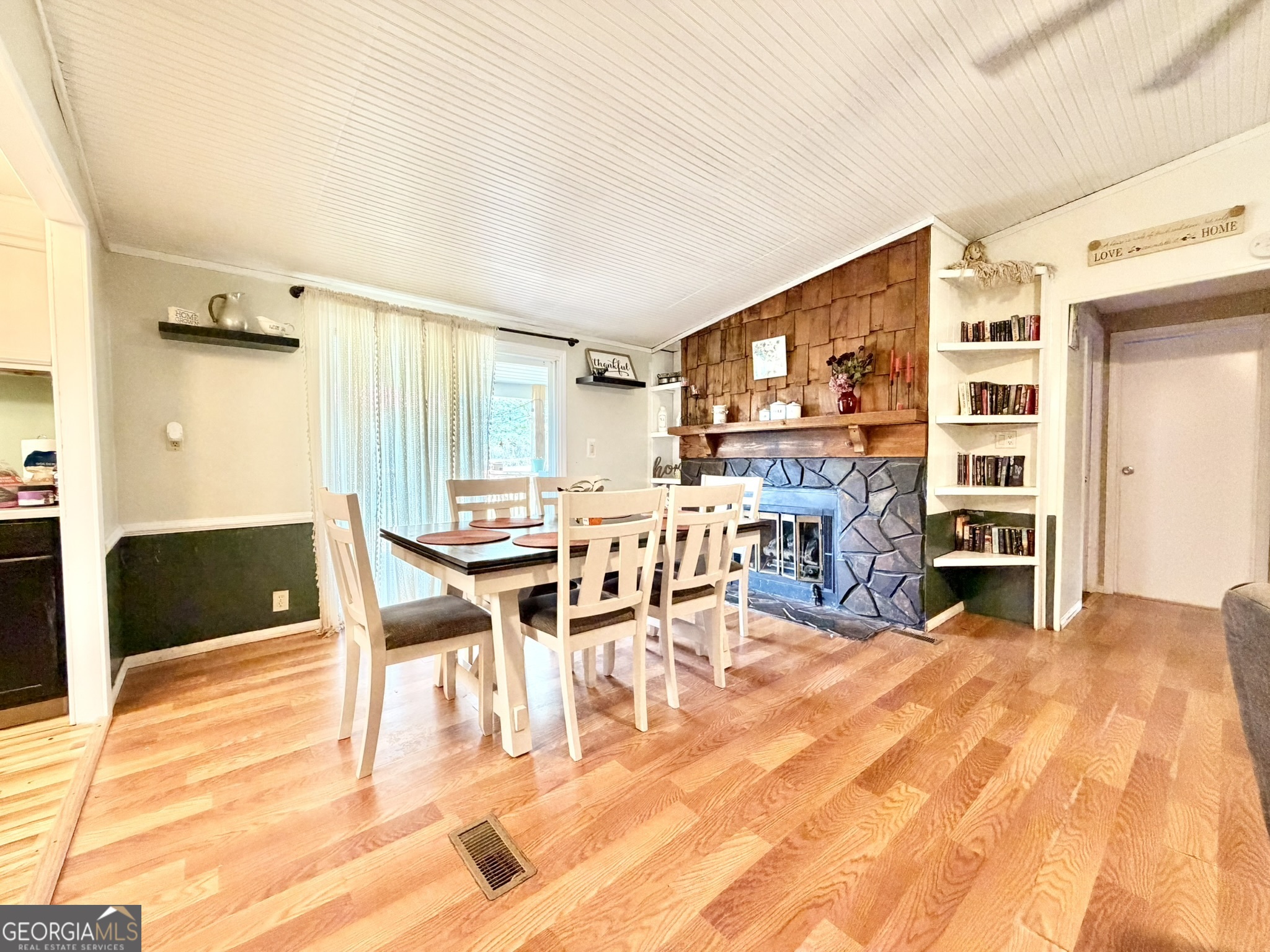 94 Country Place Temple, GA 30179 - Photo 20 of 36 a living room with furniture a dining table and a fireplace