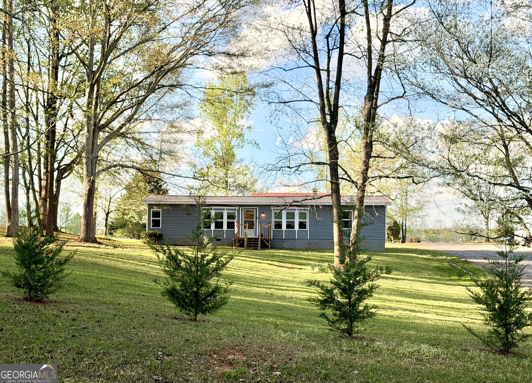 94 Country Place Temple, GA 30179 - Photo 2 of 36 a view of a house with a swimming pool