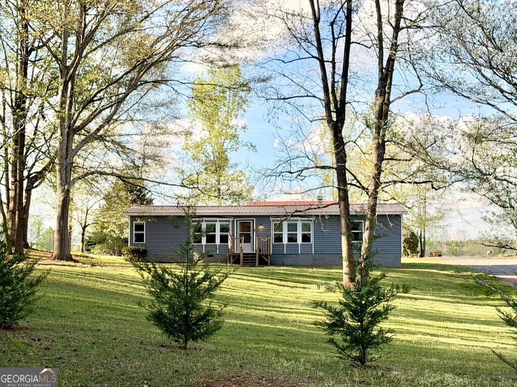 94 Country Place Temple, GA 30179 - Photo 3 of 36 a view of a house with a swimming pool