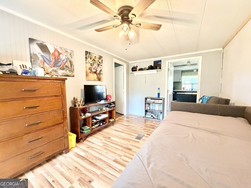 94 Country Place Temple, GA 30179 - Photo 32 of 36 a bedroom with a bed a flat screen tv and a dresser