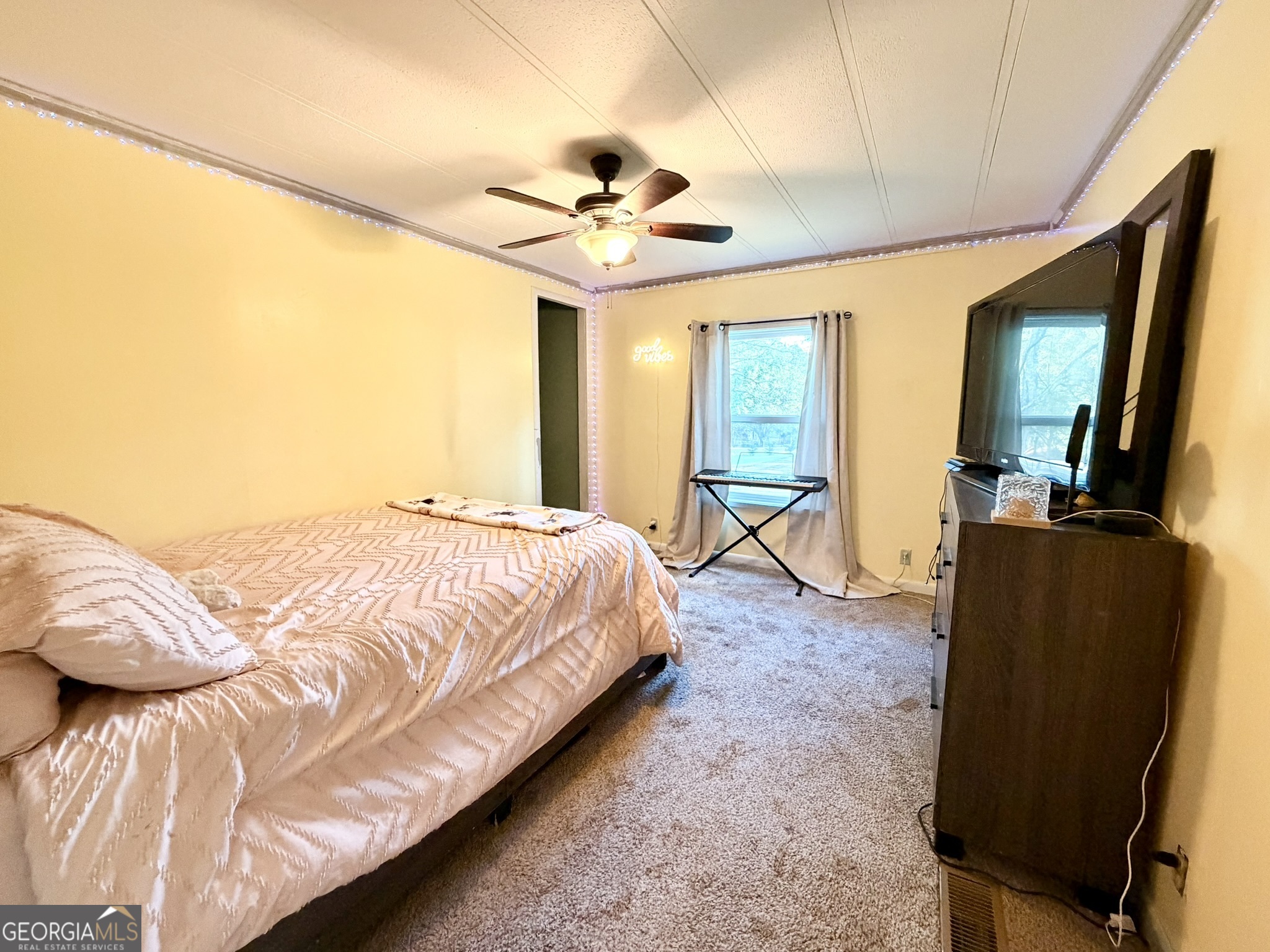 94 Country Place Temple, GA 30179 - Photo 33 of 36 a spacious bedroom with a bed and wooden floor