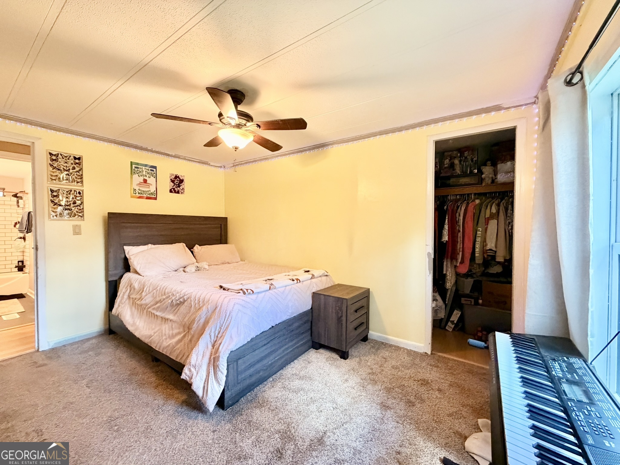 94 Country Place Temple, GA 30179 - Photo 34 of 36 a bedroom with a bed and a ceiling fan