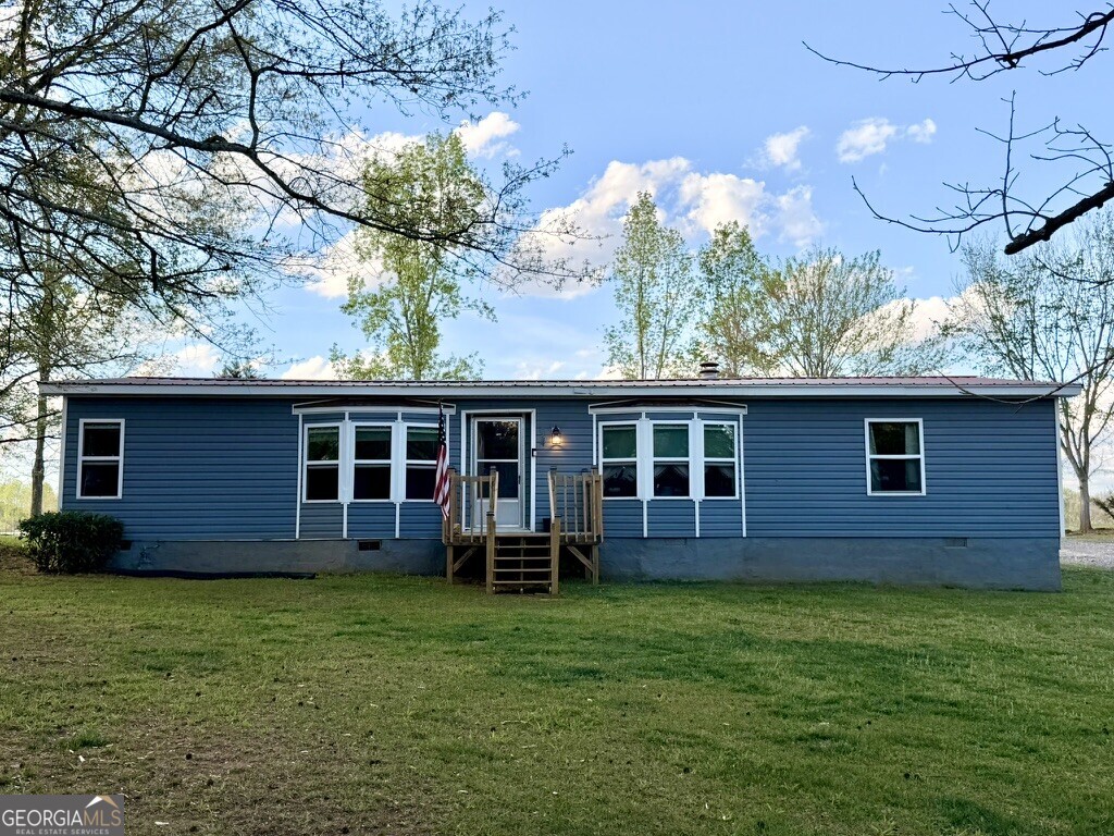 94 Country Place Temple, GA 30179 - Photo 5 of 36 a view of a house with a backyard