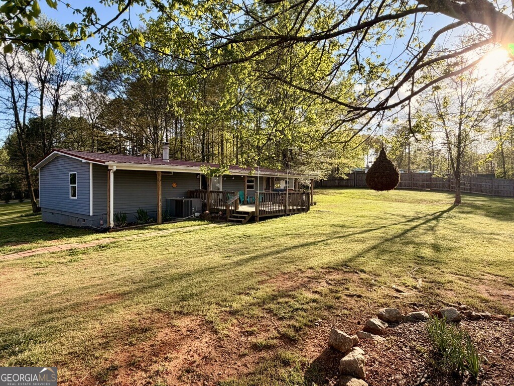 94 Country Place Temple, GA 30179 - Photo 9 of 36 a front view of a house with a yard and garage