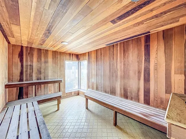 a reading room with furniture and a book shelf
