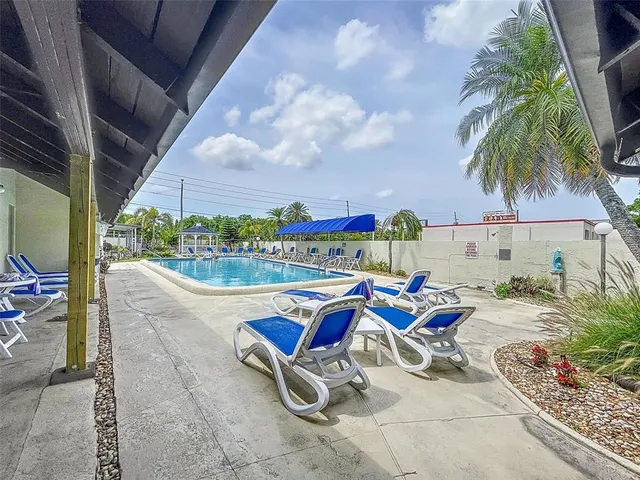 a view of a chair and table in balcony