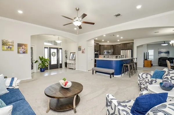 a living room with furniture and a large window