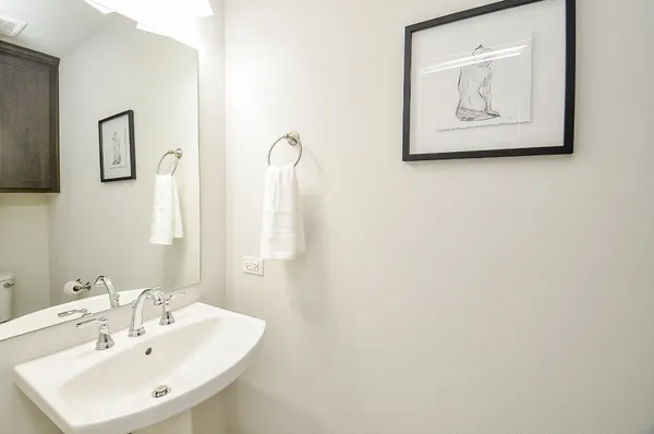 a bathroom with a granite countertop sink a toilet and bathtub