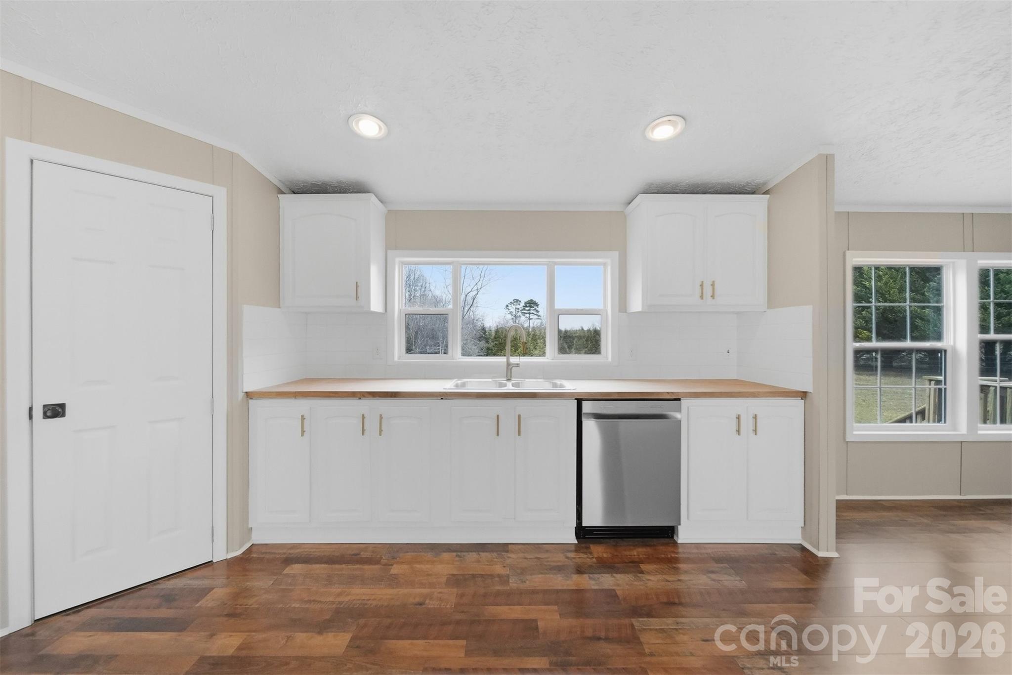 3150 Cranberry Road Boonville, NC 27011 - Photo 19 of 45 a kitchen with a sink cabinets and window