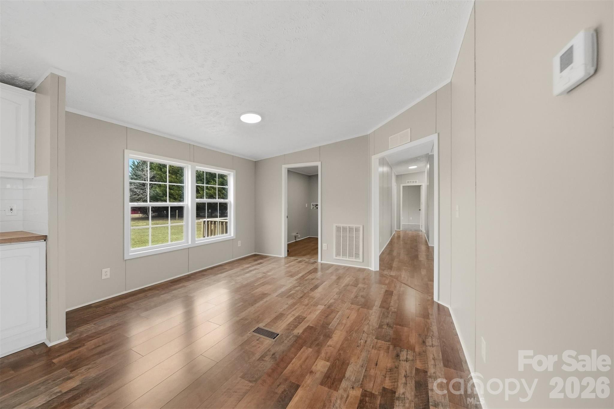 3150 Cranberry Road Boonville, NC 27011 - Photo 20 of 45 a view of wooden floor and windows in a room