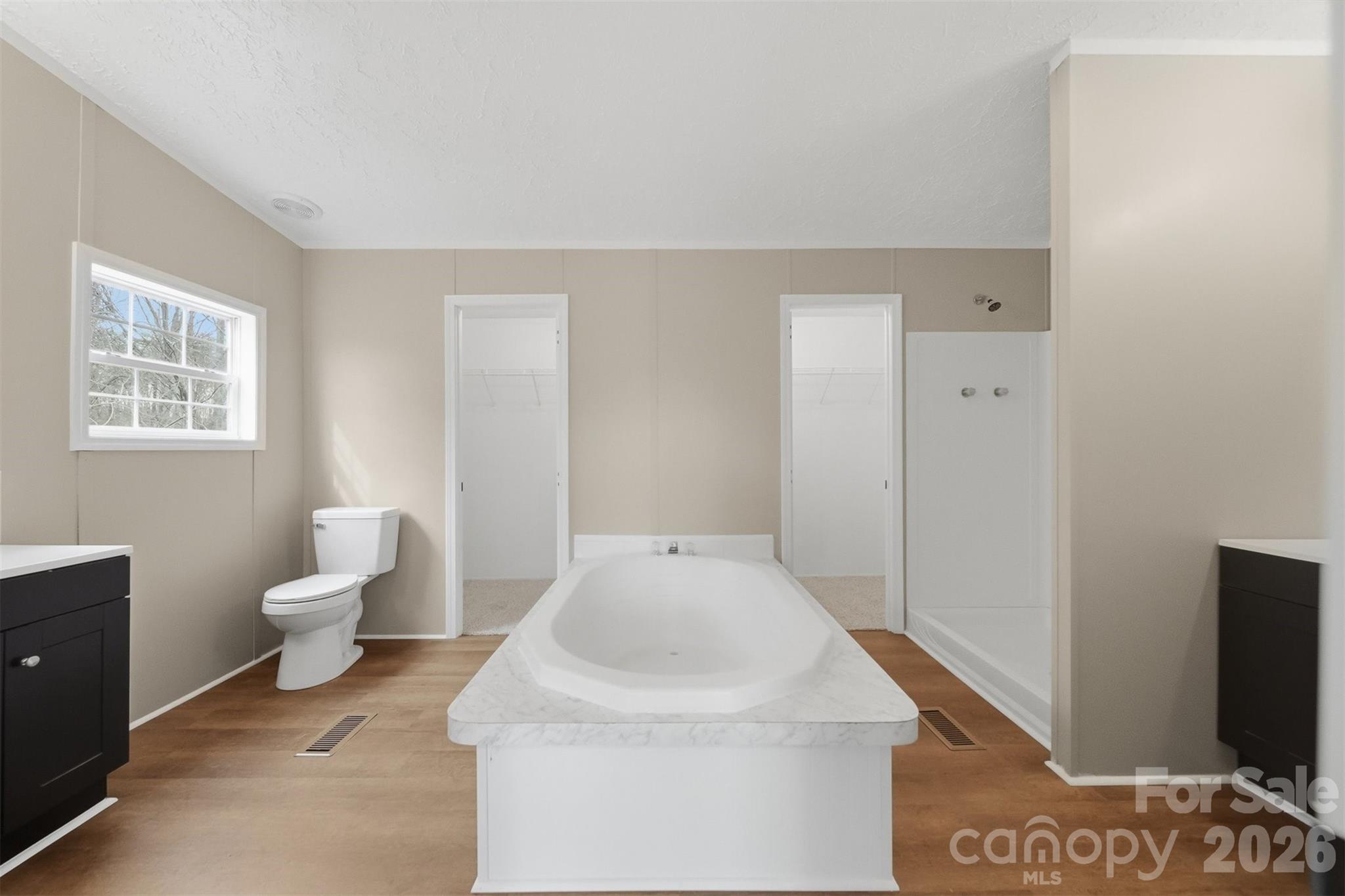 3150 Cranberry Road Boonville, NC 27011 - Photo 26 of 45 a bathroom with a sink a toilet and a mirror