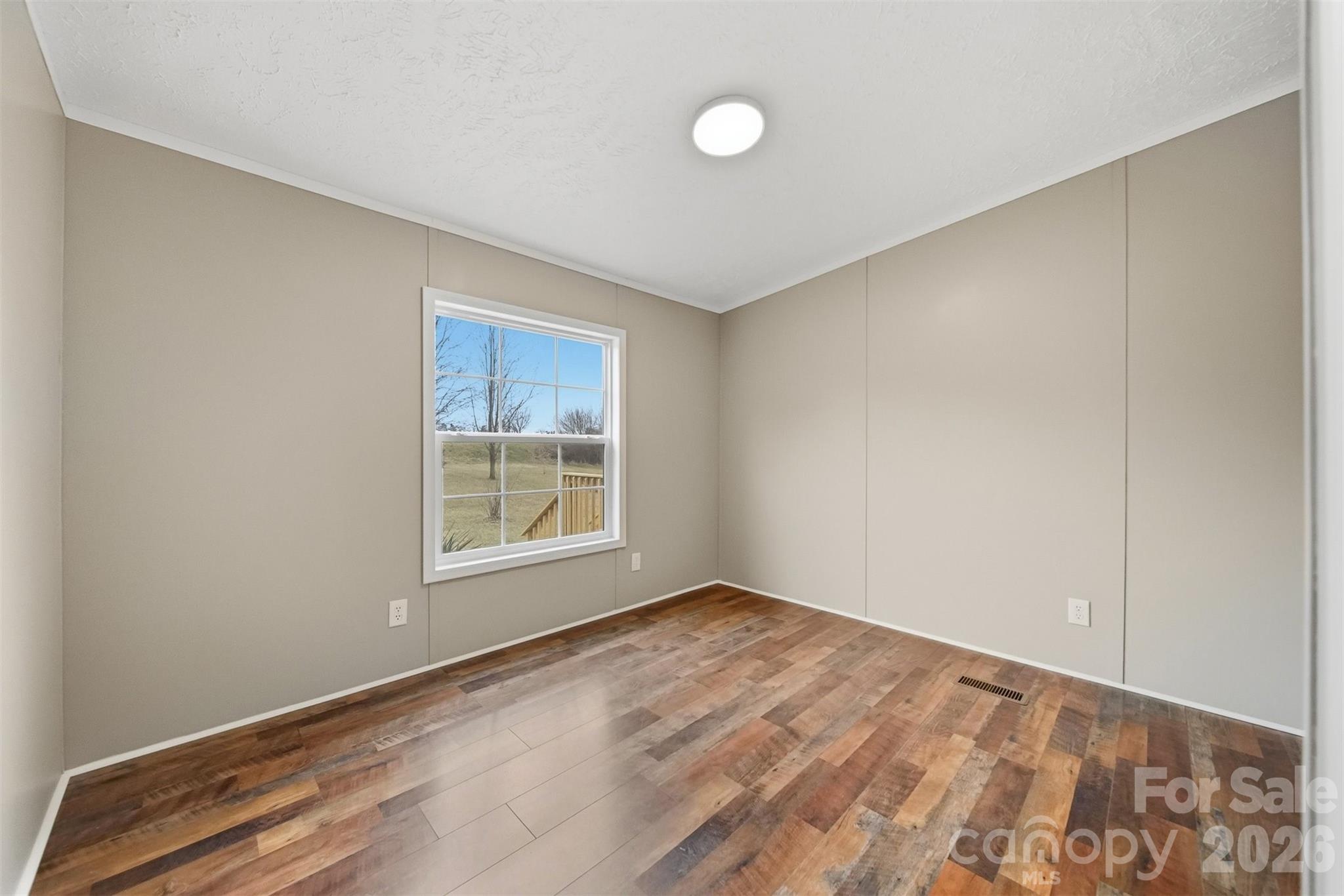 3150 Cranberry Road Boonville, NC 27011 - Photo 30 of 45 a view of an empty room with a window