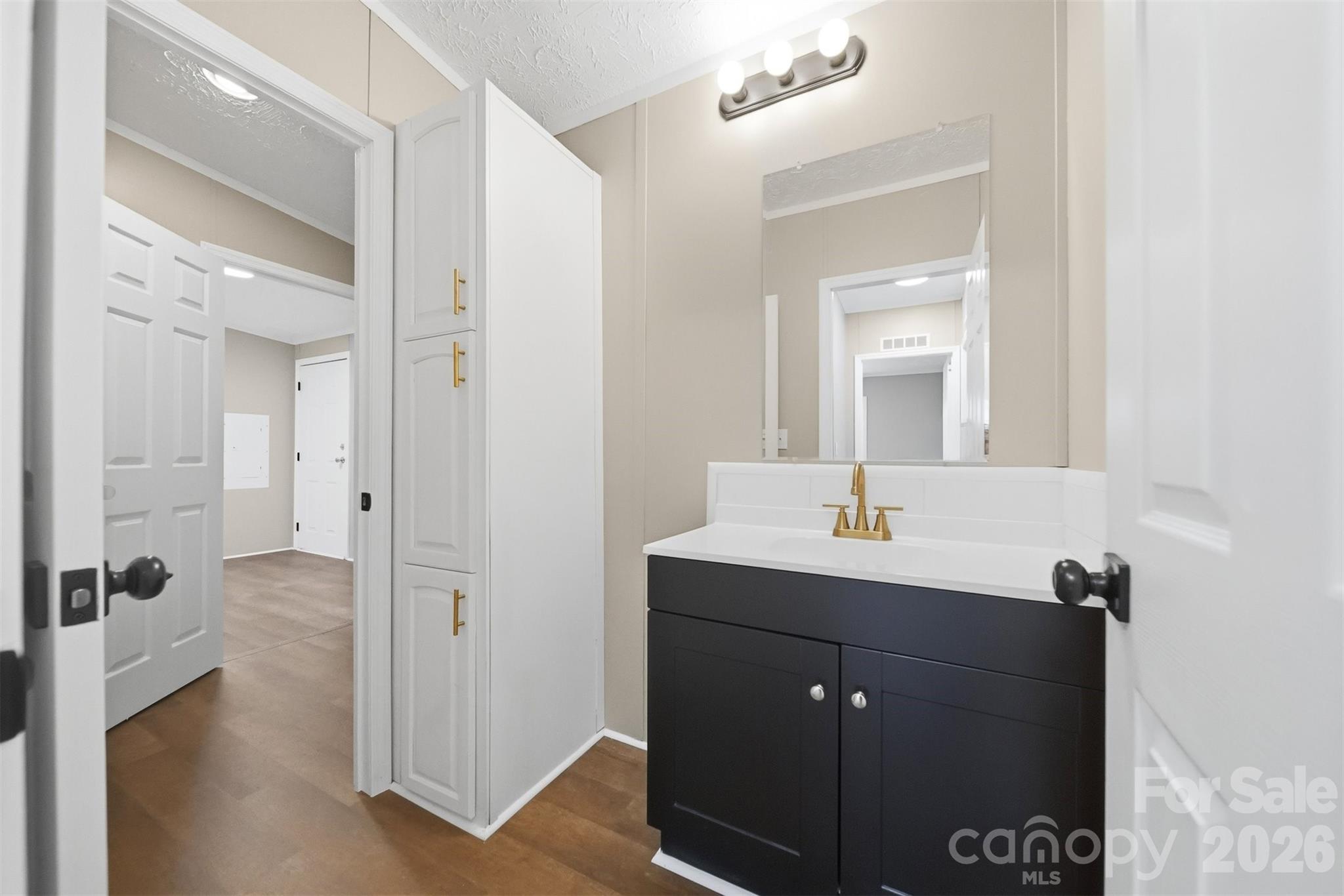 3150 Cranberry Road Boonville, NC 27011 - Photo 34 of 45 a bathroom with a sink and a mirror