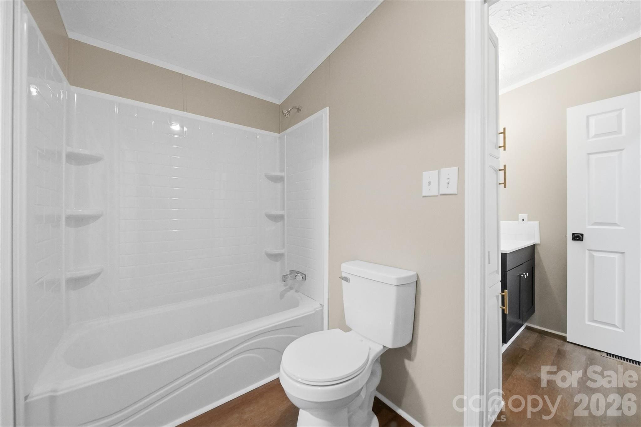3150 Cranberry Road Boonville, NC 27011 - Photo 35 of 45 a bathroom with a toilet and a bath tub