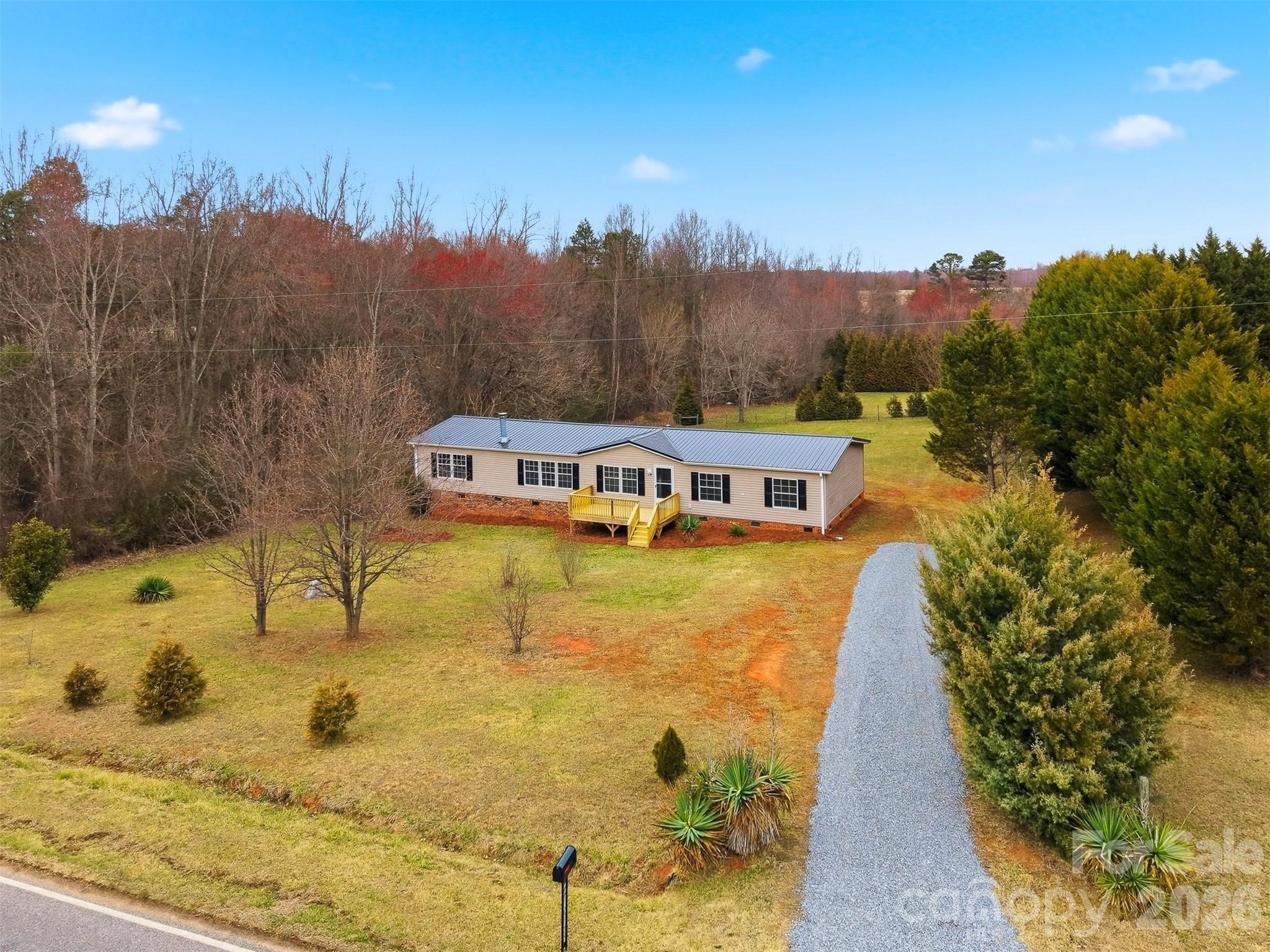 3150 Cranberry Road Boonville, NC 27011 - Photo 37 of 45 a view of a house with a yard