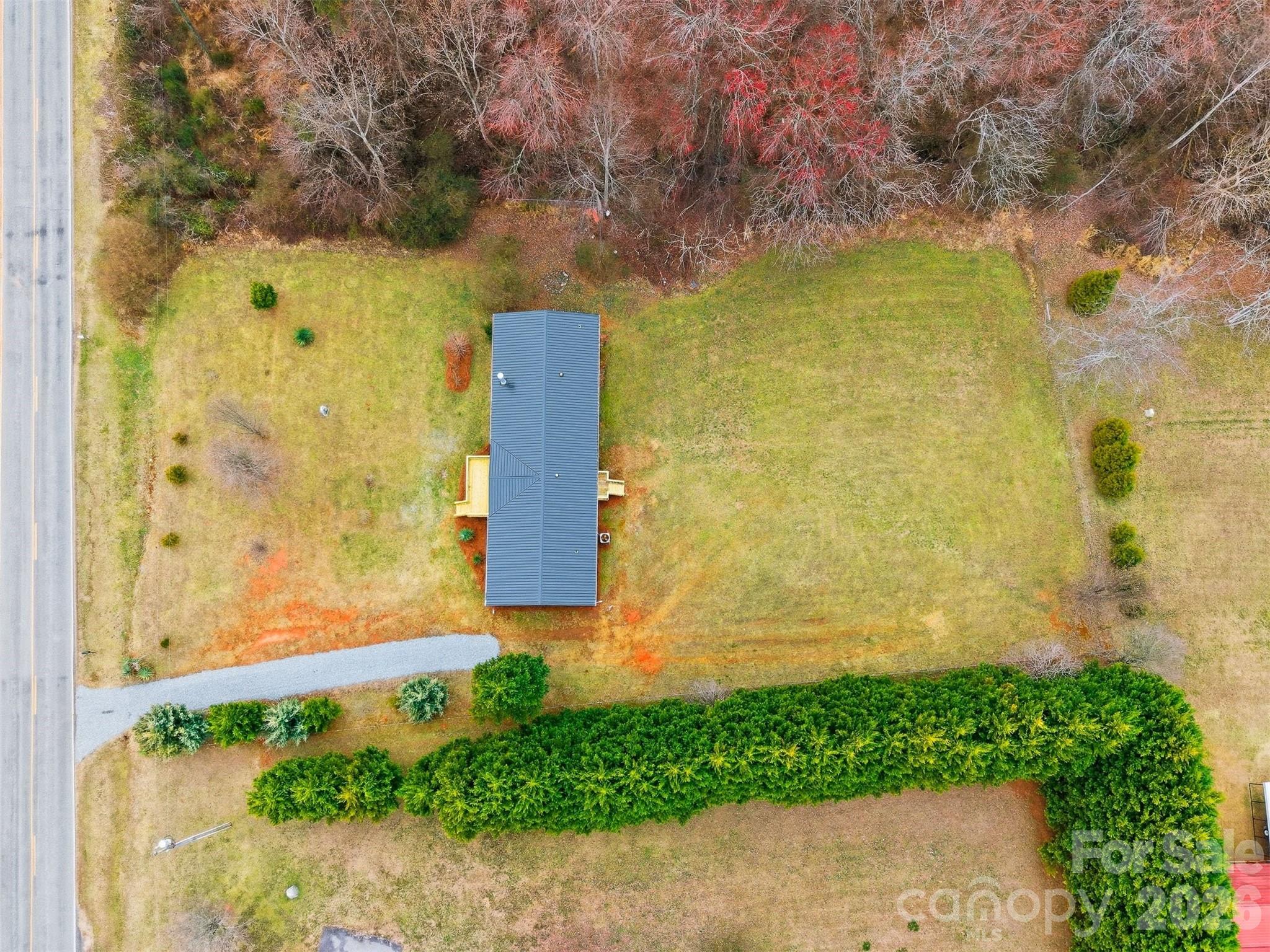 3150 Cranberry Road Boonville, NC 27011 - Photo 44 of 45 a building with a yard