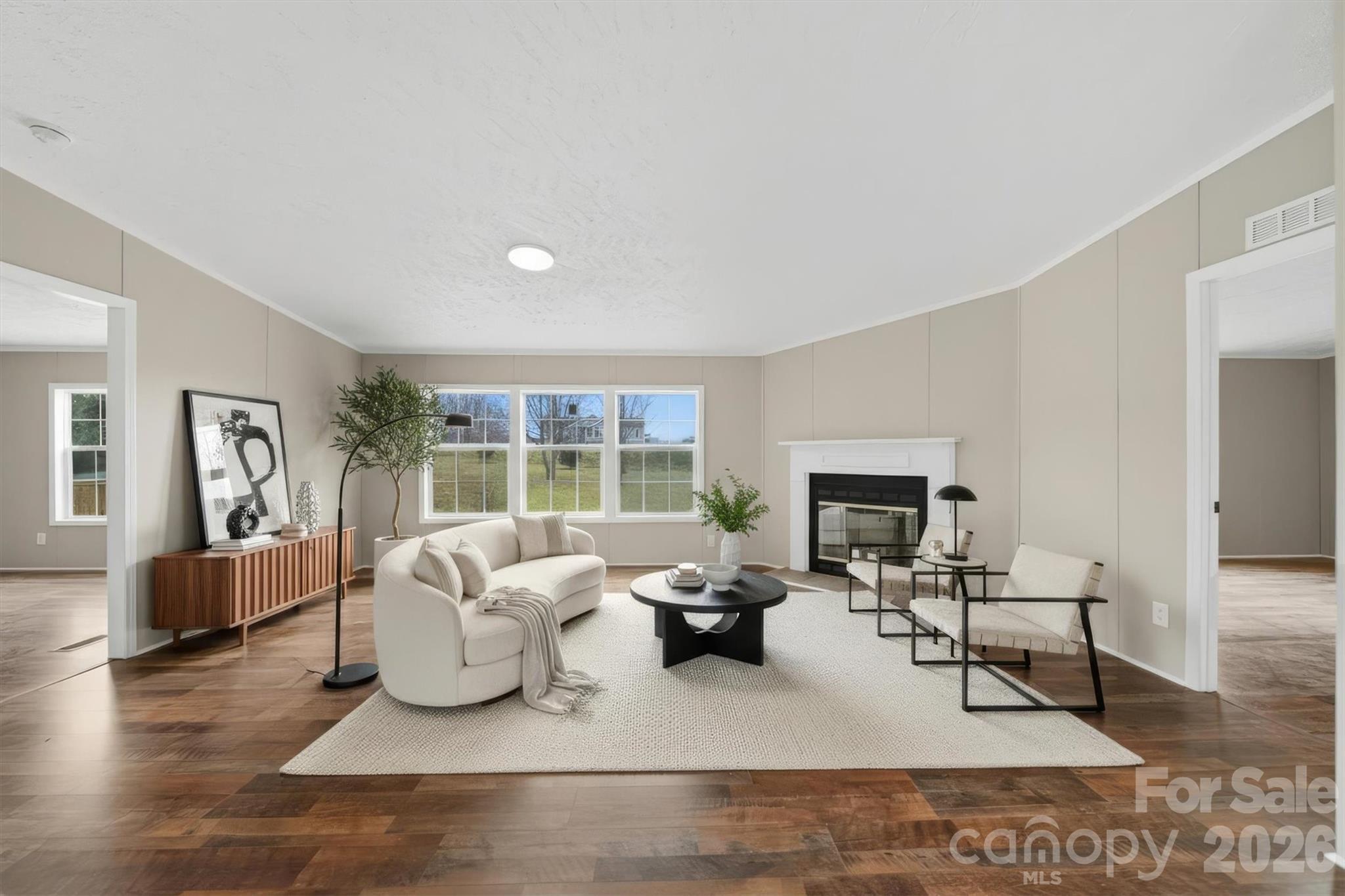3150 Cranberry Road Boonville, NC 27011 - Photo 5 of 45 a living room with furniture and a fireplace