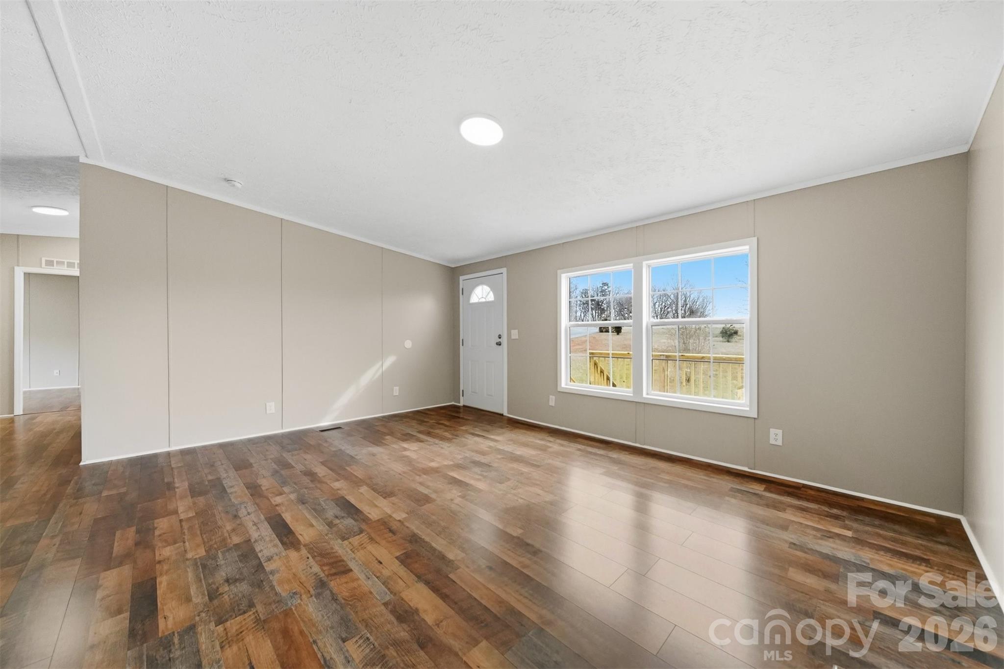 3150 Cranberry Road Boonville, NC 27011 - Photo 7 of 45 a view of an empty room with a window
